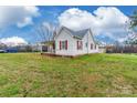 Exterior view of a quaint single story home with white siding and a spacious lawn at 2455 Wellridge Rd, Chester, SC 29706