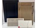 Interior design scheme showcasing black and wood cabinet door selections with white marble countertop samples at 333 Basil Dr, Indian Trail, NC 28079