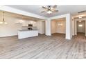 Open-concept kitchen with white cabinets, granite countertops, stainless steel appliances, and pendant lighting at 5609 Morgan Mill Rd, Monroe, NC 28110