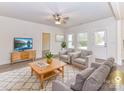 Bright living room with neutral tones, ceiling fan, stylish furniture, and plenty of natural light at 5609 Morgan Mill Rd, Monroe, NC 28110