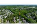 Beautiful home nestled among mature trees in a serene neighborhood at 653 Buckleigh Nw Ct, Concord, NC 28027