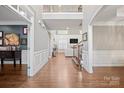 Grand foyer featuring gleaming hardwood floors, elegant trim, and an open view to the living area at 722 Fairway Point Dr, Fort Mill, SC 29708