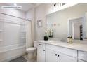 Bright bathroom with white vanity, tub and shower combo, providing a clean and modern aesthetic at 8117 Jacey Ln # 42, Huntersville, NC 28078