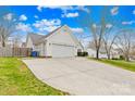 A large concrete driveway leads to an attached two-car garage in a quiet neighborhood at 134 Citation Dr, Mooresville, NC 28117