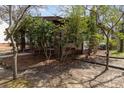 Cozy home exterior showcasing mature trees and a well-kept yard at 211 W 6Th Ave, Gastonia, NC 28052