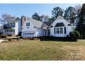 Inviting home with an attached garage, lush front lawn, and mature trees in a Gathering-friendly neighborhood at 2129 Belle Chase Dr, Rock Hill, SC 29732