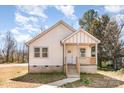 Charming exterior of home with light siding, covered porch, and well-maintained walkway at 213 Shannonhouse W St, Shelby, NC 28152