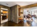 A spacious foyer with dark floors, detailed trim, an antique clock and views into other rooms at 300 N Fulton St # 12, Salisbury, NC 28144