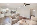 Open concept living room with a view of the modern kitchen and stainless appliances at 4136 Woodgreen Ter, Charlotte, NC 28205