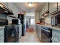 Functional kitchen with black appliances and ample counter space, conveniently located next to the dining area at 7633 Holly Grove Ct, Charlotte, NC 28227