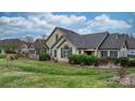Charming home exterior with stone accents, lush landscaping, and a well-manicured lawn at 824 Wynnshire Dr # D, Hickory, NC 28601