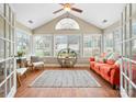 Bright sunroom with large windows, vaulted ceiling, and comfortable seating at 824 Wynnshire Dr # D, Hickory, NC 28601