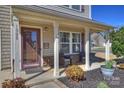 Inviting covered front porch with seating area and manicured landscaping details at 1008 Newton Ave, Rock Hill, SC 29732