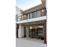 Close-up of the exterior with stone accents, metal railings, and craftsman columns at 108 Isle Of Pines Rd # 3, Mooresville, NC 28117