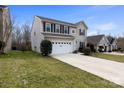 Beautiful two-story home with a spacious driveway and well-kept front yard at 1432 Astoria Nw Ln, Concord, NC 28027