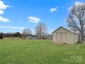 Spacious backyard with a large shed, providing ample storage and room for outdoor activities at 1465 Earl St, Hickory, NC 28602