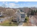 Two-story home with neutral siding, dark roof, attached garage and mature trees at 166 Chere Helen Dr, Mooresville, NC 28115