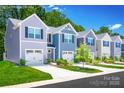 A variety of townhomes with individual garages, and various colors each with beautiful, contemporary curb appeal at 2061 Stephens Farm Dr, China Grove, NC 28023