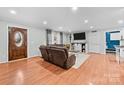 Inviting living room with hardwood floors, sliding barn doors and modern decor at 24253 Old Aquadale Rd, Albemarle, NC 28001