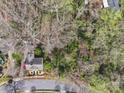 Aerial view of a home nestled among trees and greenery, offering privacy at 311 3Rd Avenue Se Dr, Hickory, NC 28602