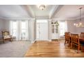 Bright, open-concept living room featuring hardwood floors, natural light, and elegant architectural details at 3329 Brownes Creek Rd, Charlotte, NC 28269