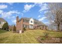 Brick home with mature trees in the yard at 4421 3Rd Nw St, Hickory, NC 28601