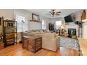 Spacious living room featuring hardwood floors, a cozy fireplace, and a comfortable gray couch at 514 3Rd Avenue Se Dr, Hickory, NC 28602