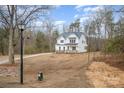 Charming two-story home with a manicured lawn, complemented by mature trees and landscaping at 558 Edmunds Ln # 41, Clover, SC 29710