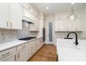 Beautiful kitchen featuring white cabinets, quartz countertops, and a decorative backsplash at 558 Edmunds Ln # 41, Clover, SC 29710