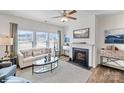 Cozy living room with a fireplace, comfortable seating, and ample natural light at 587 N Sparkleberry St, Chester, SC 29706