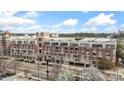 Exterior view of the apartment building showcasing its brick facade and balconies at 710 W Trade St # 309, Charlotte, NC 28202