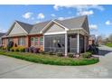 Beautiful brick home featuring a lovely screened-in porch and well-maintained landscaping at 8146 Viscount Ct, Denver, NC 28037