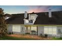 Back view of house exterior with balcony, windows, and outdoor seating at 8534 Loxton Cir, Charlotte, NC 28214