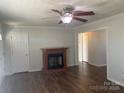 Cozy living room featuring a fireplace and hardwood floors at 9450 Paul Payne Store Rd, Stony Point, NC 28678