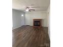 Bright living room featuring a fireplace and hardwood floors at 9450 Paul Payne Store Rd, Stony Point, NC 28678