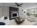 Cozy living room with a brick fireplace, modern furniture, and a ceiling fan at 10405 Club Car Ct, Mint Hill, NC 28227