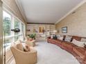 Large living room boasting a curved leather sofa, built-in shelving, and lots of natural light at 109 Joe Teague Rd, Hickory, NC 28601