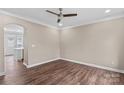 A bright living room flows into a kitchen area, complete with hardwood floors and neutral colors at 163 Singleton Rd, Mooresville, NC 28117