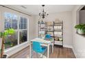 Dining room features natural light and modern shelving with stylish décor at 17527 Tuscany Ln, Cornelius, NC 28031