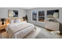 Calm staged main bedroom with large windows, neutral colors, and modern decorations at 1913 Leesburg Dr, Clover, SC 29710