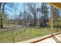 Scenic backyard view from the porch, showcasing the natural surroundings at 2519 Arnold Dr, Monroe, NC 28110