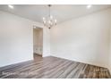 Bright dining room with wood floors and an elegant chandelier at 2783 Ashton Park Ln # 67, Monroe, NC 28110