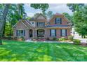 Charming two-story home with a combination of brick and stone exterior and well-manicured lawn at 303 Ridge Reserve Dr # 29, Clover, SC 29710