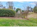 Stone Heron Cove neighborhood sign surrounded by green grass, shrubs, and trees on a sunny day at 303 Ridge Reserve Dr # 29, Clover, SC 29710