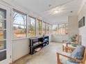 Bright sunroom with many windows providing lots of natural light and lovely backyard views at 3350 Bonneville Dr, Charlotte, NC 28205