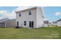 Large grassy backyard with sliding glass doors, ideal for outdoor entertaining and relaxation at 3540 Clover Valley Dr, Gastonia, NC 28052