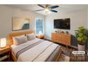 Serene main bedroom with wood floors, modern furniture, a ceiling fan and a window at 3937 Northerly Island Ct, Gastonia, NC 28056