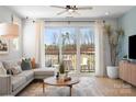 Comfortable living room with sliding door access to the balcony and bright natural light at 5723 Castlerea Dr, Charlotte, NC 28217