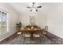 Formal dining room with wooden table, chairs, a decorative rug, and a window, perfect for gatherings at 822 Bethlehem Rd, Kings Mountain, NC 28086