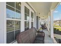 Inviting covered front porch area with seating at 8638 Raven Top Dr, Mint Hill, NC 28227